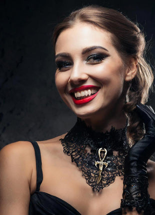 Susannah is wearing the 3rd Generation Legacy Ankh in Gold over Sterling Silver with Black Moonstone. She is wearing Brooklyn Doubles 3D printed fangs by Sabretooth Fangs. Makeup by JoHanna Moresco.
