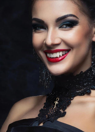 Ester is wearing a 2nd Generation Small Legacy Ankh in 14K Gold over Sterling Silver. She is wearing Sabres 3D printed fangs  from  Sabretooth Fangs.  Makeup by JoHanna Moresco.